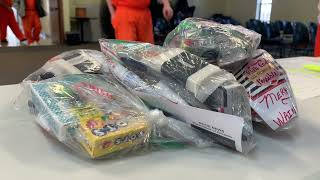 Prison staff and volunteers bless inmates