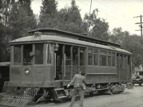 Harold Lloyd drives a Pacific Electric trolley in ...