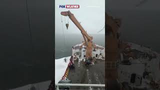 The U.S. Coast Guard Uses An Icebreaker Vessel To Rescue A Stranded Snowmobile Operator