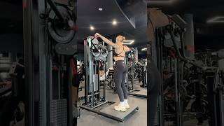 Standing lateral raise machine