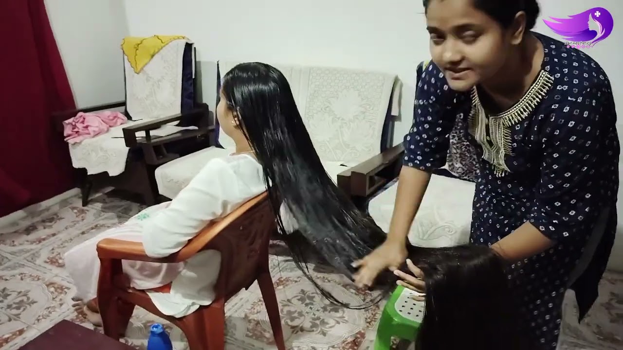 Heavy Oil Applying In Long Hair By Female Friend