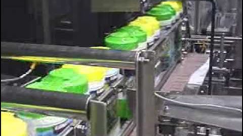 Shrink Film Packaging Machine for Canisters in a Chipboard Tray (Total Closure)