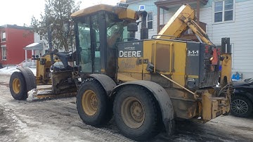 John Deere 770G Motor Grader Backing Up Quickly