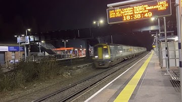 South Western Railway Class 158 and 159s passing through Esher Station.