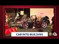 2 rescued after SUV crashes into building