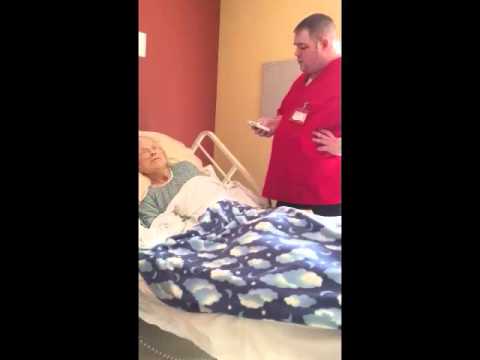 Hospice Worker Sings To Patient