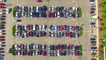 Drone flying over a parking lot full of cars - video stock