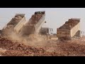 Awesome machinery operation Komatsu Bulldozer And Many dump truck unloading soil