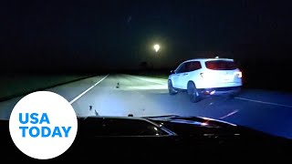 Police dashcam shows daring rescue of teen in runaway car | USA TODAY