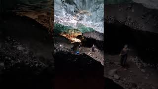 Group of Visitors in an Ice Cave within a Glacier