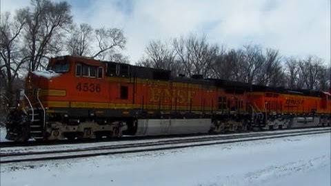 BNSF intermodal with H3 Dash 9 heads through the snow at Agency, Iowa