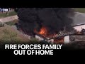 Flames shoot out from Phoenix home&#39;s roof