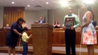 McAllen mayor Jim Darling presenting keys to the city to 2 blind MISD students.