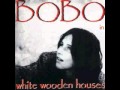 Bobo in white wooden Houses - Hole in Heaven