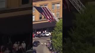Hearse carrying Sgt. Pruitt moves through Bardstown under giant flag