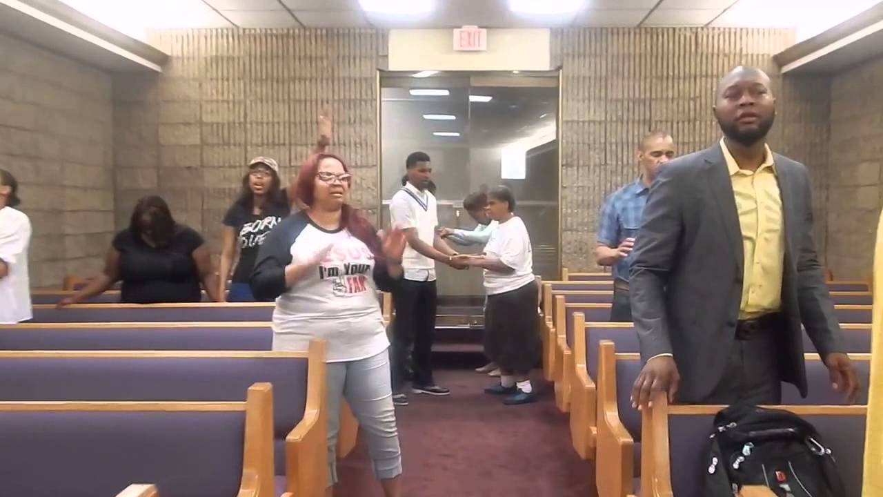 Elder Damien Sneed singing during Corporate Prayer