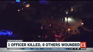 1 officer killed, 6 others wounded