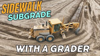 Grading a Sidewalk Subgrade with a Grader