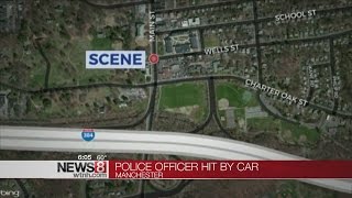 Manchester police officer hit by car while crossing road