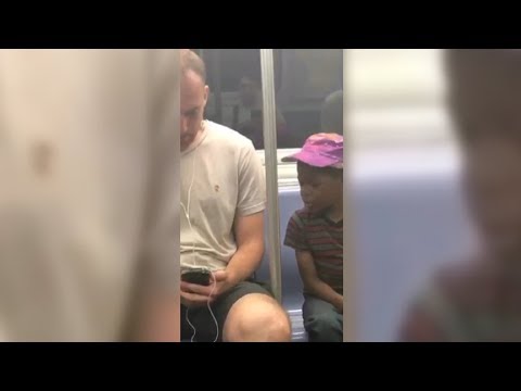 NYC Subway Passenger Lets Adorable Little Boy Play On His Phone