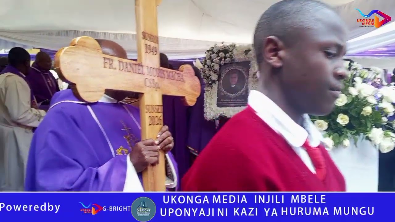 TAZAMA MWILI WA PADRE DANIEL MORRIS MACHA CSSP UKIELEKEA  KWENYE NYUMBANI YAKE YA MILELE 