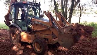 Case 580M Moving Rocky Soil