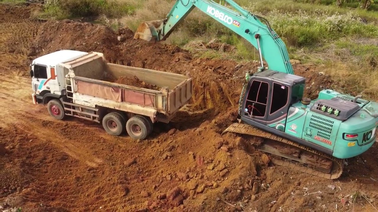 Excavator and big tractor working together in the farm !