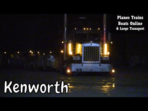 Black Kenworth Truck Backing In At Truck Stop