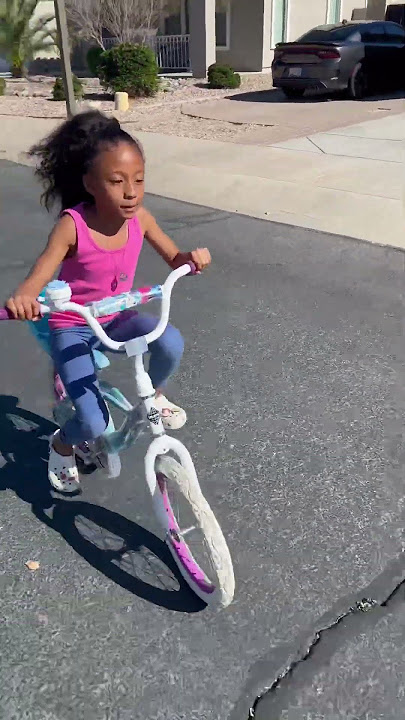 HER FIRST TIME RIDING A BIKE!