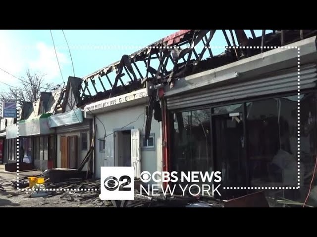 Fire Damages Businesses Along A Strip Mall As Well As Two Small Churches In Queens