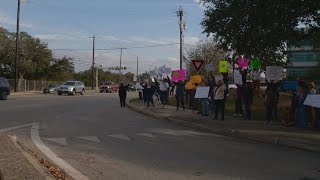 Governor Abbott's visit to SA met with protesters rallying against school voucher bill