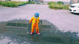 Cute baby dancing and kicking in the water