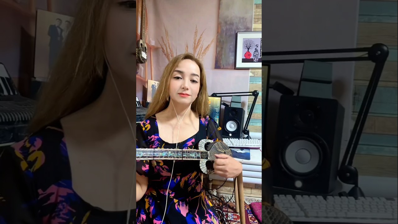 Uyghur people/Uyghur artist playing the Rawap