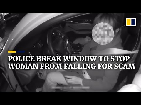Police break car window to stop woman from falling for phone scam