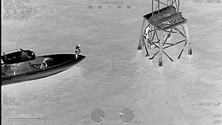 HCSO Aviation and Marine Units conducting a water rescue at night in Tampa, Florida.