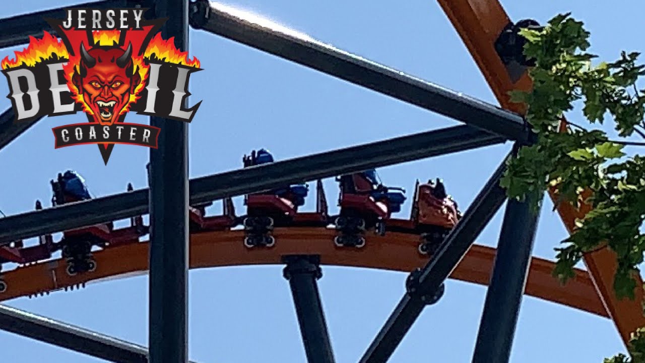 Jersey Devil Coaster, Six Flags Great Adventure], valleyed during a test  run. Visible from Nitro's lift hill is one of the Jersey Devil Coaster  trains valleyed in the dip before the mid-course