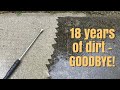 Time lapse of power washing a dirty concrete sidewalk