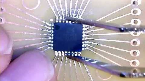 Hand Soldering an Atmega8A TQFP32 on to a breakout board.