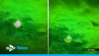 Partial solar eclipse sees moon cover fifth of the sun over Scotland