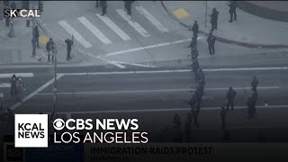 Police issue dispersal order as protesters continue to move through downtown LA