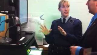 LiveScan fingerprinting demonstration at Airdrie RCMP Detachment
