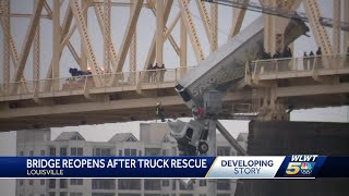 Louisville bridge reopens after driver rescued from semitrailer dangling over Ohio River
