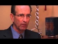 Terry Abeyta talks with client Fred Mahre about his car accident case.