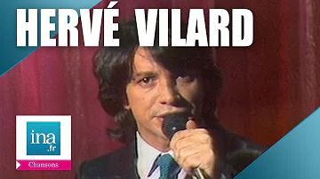 Qui a écrit la chanson nous d'Hervé Vilard ?