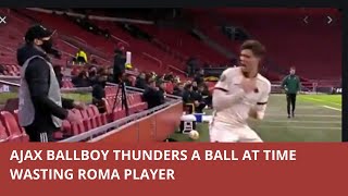 Frustrated Ajax ball boy hurls the ball at  time-wasting Roma's Riccardo Calafiori