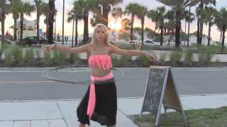 Pretty Girls Hula Hooping at Sunset on the Beach