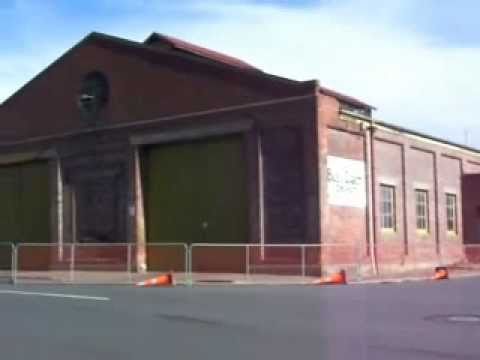 Timaru New Zealand old brick bus sheds and garage condemned after Christchurch earthquake 160 Km away. Building has now been demolished, as per photograph at end of video.