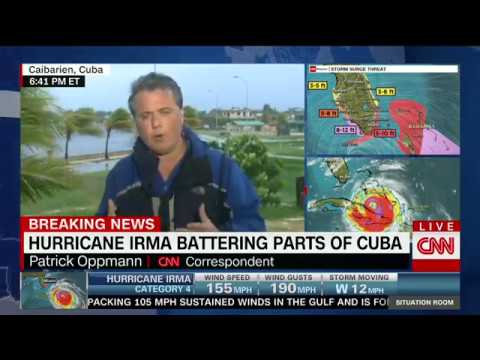 Reporter struggles against Irma's wind, rain