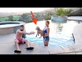 TRYING TO TEACH MY PUPPY HOW TO SWIM!!