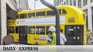 Double-decker bus crashes into building in central London
